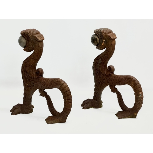 13 - A pair of early/mid 19th century cast iron ‘Sea Lion’ andirons. 23x26cm