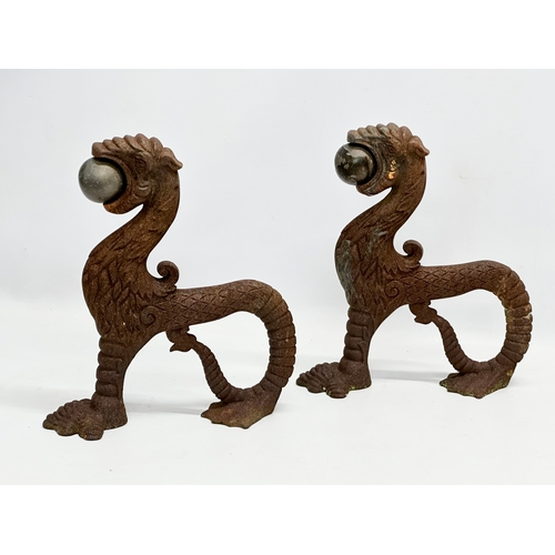 13 - A pair of early/mid 19th century cast iron ‘Sea Lion’ andirons. 23x26cm