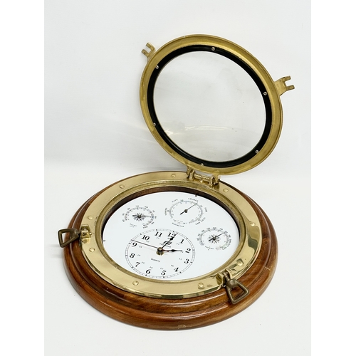 92 - A Plastimo Porthole Weatherman barometer wall clock. 34.5cm