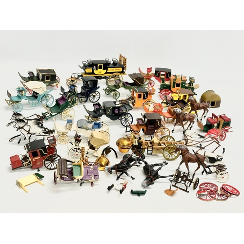 455 - A collection of Brumm horse and carriages.