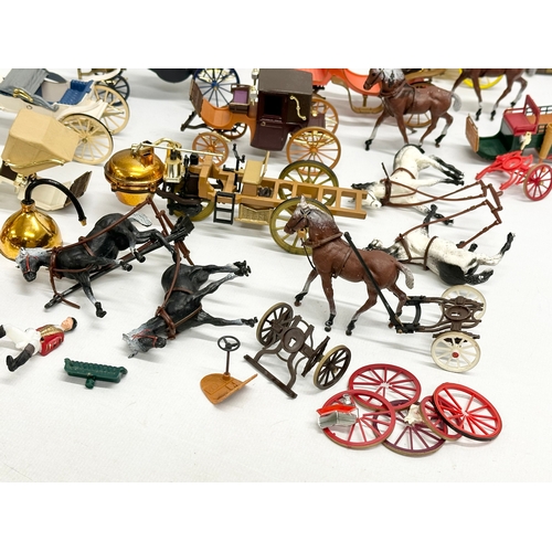 455 - A collection of Brumm horse and carriages.