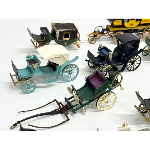 455 - A collection of Brumm horse and carriages.