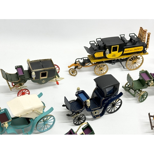 455 - A collection of Brumm horse and carriages.