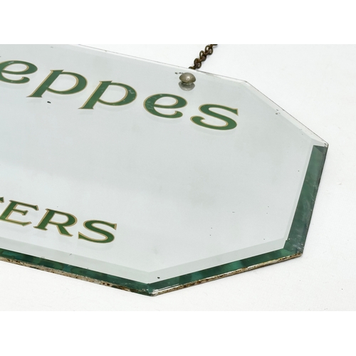 56 - An early 20th century Schweppes Irish Table Waters advertising bevelled mirror. 51x31cm