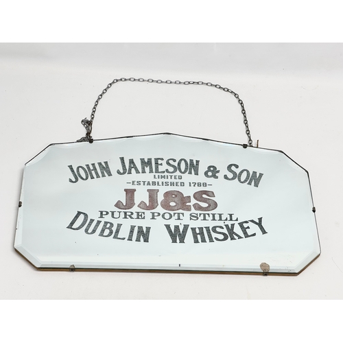 57 - An early 20th century John Jameson & Son (JJ&S) Dublin Whiskey advertising mirror. 61x36cm