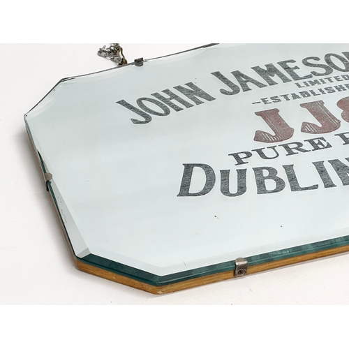 57 - An early 20th century John Jameson & Son (JJ&S) Dublin Whiskey advertising mirror. 61x36cm