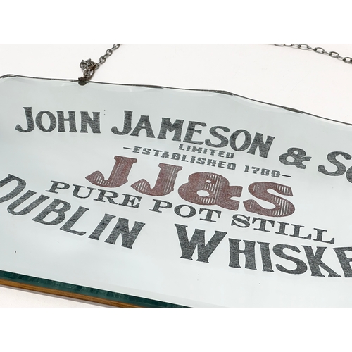 57 - An early 20th century John Jameson & Son (JJ&S) Dublin Whiskey advertising mirror. 61x36cm