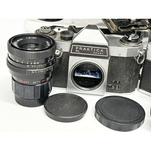 529 - A collection of vintage cameras and lenses. A Praktica MTL 50 camera. A Praktica PL noval camera. A ... 