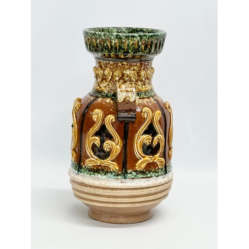 221 - A large Italian Majolica glazed pot. 18x31.5cm