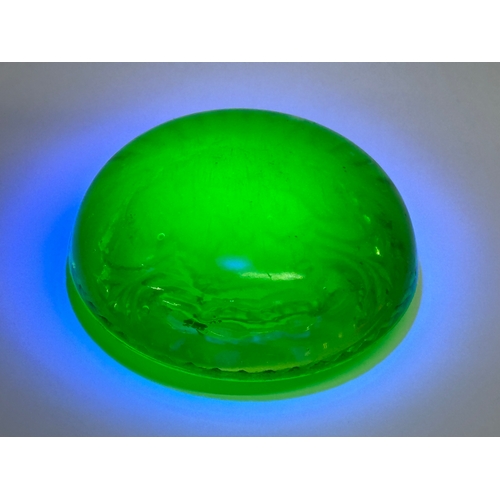 144 - A late 19th/early 20th century uranium glass paperweight. 8x3cm