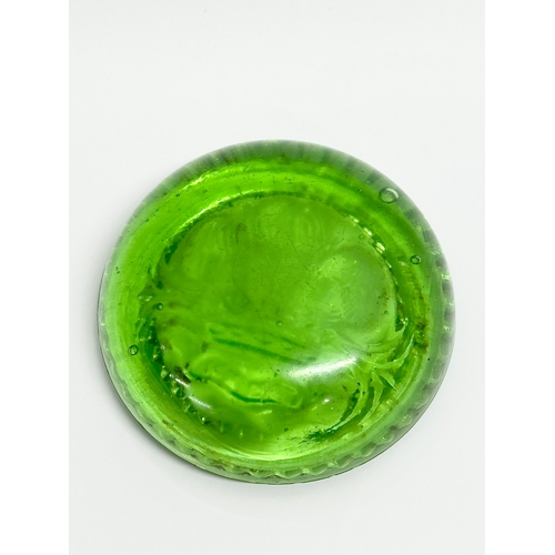 144 - A late 19th/early 20th century uranium glass paperweight. 8x3cm