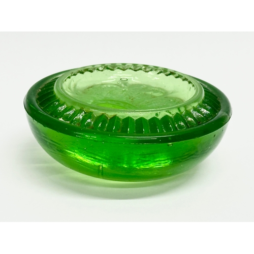 144 - A late 19th/early 20th century uranium glass paperweight. 8x3cm