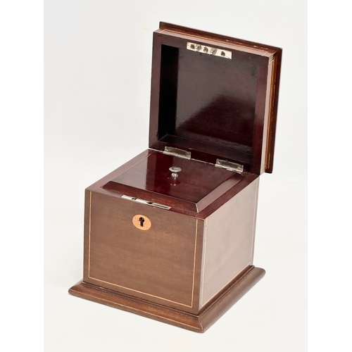 145 - An Edwardian inlaid mahogany tea caddy. 15x15x15cm