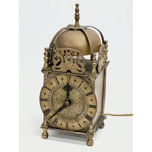 556 - A vintage 17th century style English brass mantle clock by Smiths. 25cm