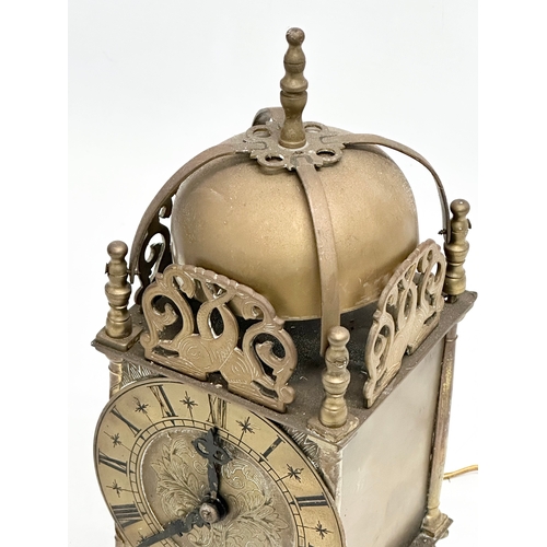 556 - A vintage 17th century style English brass mantle clock by Smiths. 25cm