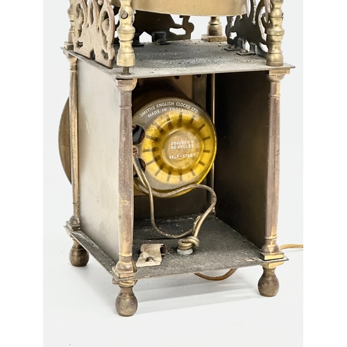 556 - A vintage 17th century style English brass mantle clock by Smiths. 25cm