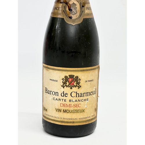 540 - 4 bottles of alcohol. 2 bottles of champagne and 2 bottles of wine. Baron De Charmeuil Carte Blanche... 