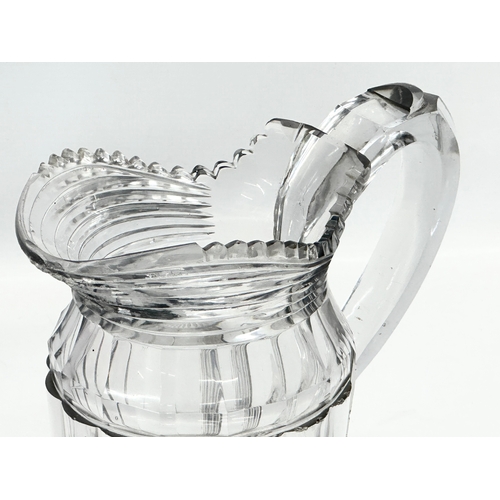 152 - A large late Georgian/early Victorian cut glass jug. Circa 1820-1850. 22x12x20.5cm.