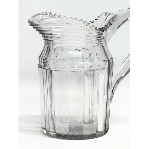 152 - A large late Georgian/early Victorian cut glass jug. Circa 1820-1850. 22x12x20.5cm.