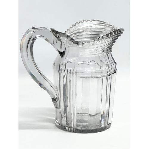 152 - A large late Georgian/early Victorian cut glass jug. Circa 1820-1850. 22x12x20.5cm.