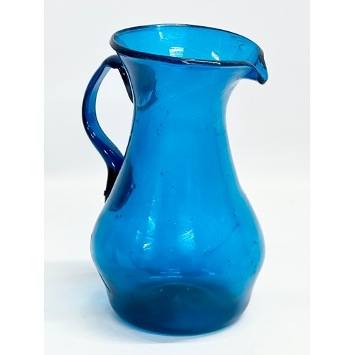 18 - A large late 18th century hand blown Bristol Blue water jug. Circa 1760-1800. 17x14x22cm