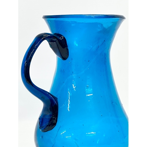 18 - A large late 18th century hand blown Bristol Blue water jug. Circa 1760-1800. 17x14x22cm