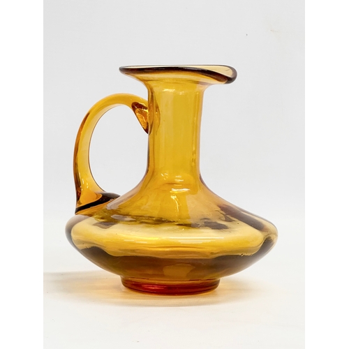 19 - An early 19th century Amber Glass jug. Circa 1800-1830. 17x16x16cm