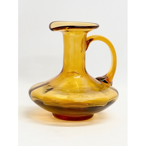 19 - An early 19th century Amber Glass jug. Circa 1800-1830. 17x16x16cm