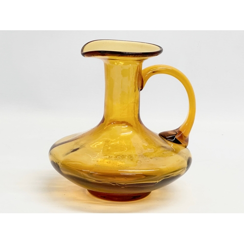 19 - An early 19th century Amber Glass jug. Circa 1800-1830. 17x16x16cm