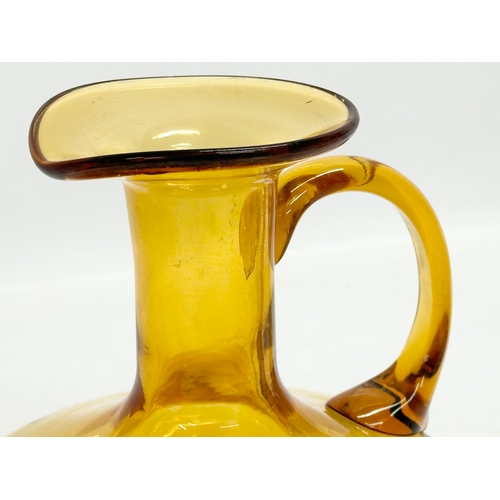 19 - An early 19th century Amber Glass jug. Circa 1800-1830. 17x16x16cm