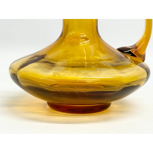 19 - An early 19th century Amber Glass jug. Circa 1800-1830. 17x16x16cm