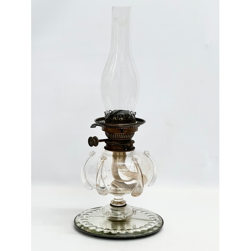 20 - A Victorian hand blown glass bowl oil lamp on sorcerers mirror base. 20x49cm