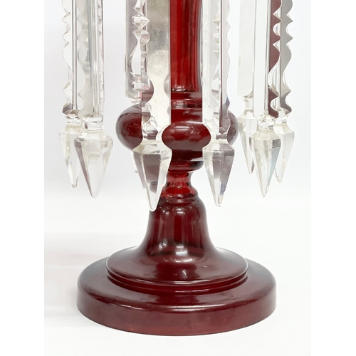 156 - A large Victorian Ruby Glass lustre with cut glass droplets. 16x35cm