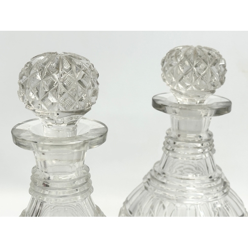 162 - A pair of early 19th century Irish 3 ring glass decanters. Circa 1820-1840. 26cm