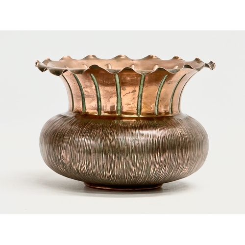 23 - Christopher Dresser. An early 20th century copper jardiniere designed by Christopher Dresser for Ben... 