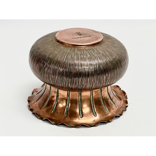 23 - Christopher Dresser. An early 20th century copper jardiniere designed by Christopher Dresser for Ben... 