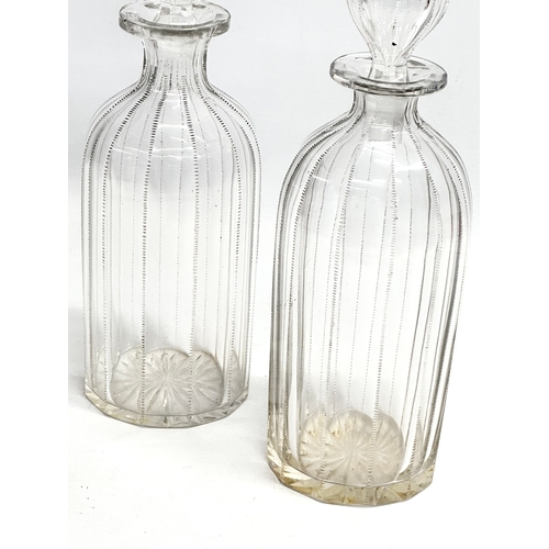 112 - A pair of 19th century Victorian glass decanters with etched wire design. 26.5cm