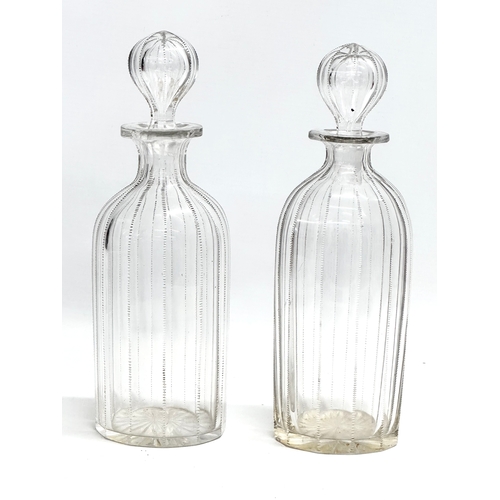 112 - A pair of 19th century Victorian glass decanters with etched wire design. 26.5cm