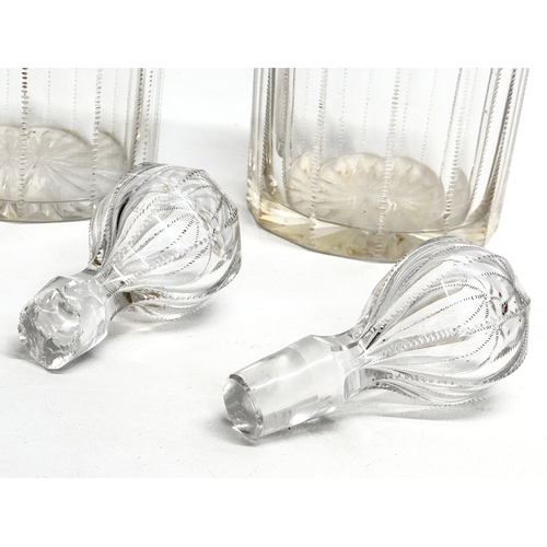 112 - A pair of 19th century Victorian glass decanters with etched wire design. 26.5cm