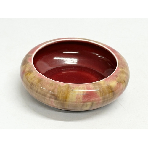 171 - An early 20th century glazed shallow bowl. Ruskin style. 11x3.5cm