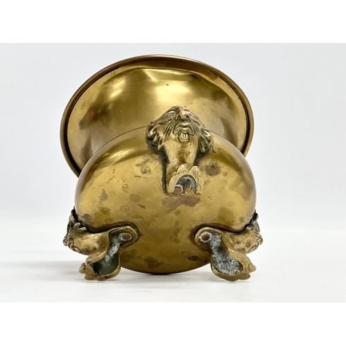 177 - An early 20th century brass jardiniere raised on 3 paw feet. 15.5x12cm