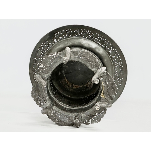 194 - A 19th century Burmese pierced Pewter stand, raised on 6 feet. Circa 1820-1860. 23x14cm