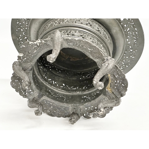 194 - A 19th century Burmese pierced Pewter stand, raised on 6 feet. Circa 1820-1860. 23x14cm