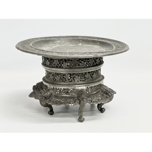 194 - A 19th century Burmese pierced Pewter stand, raised on 6 feet. Circa 1820-1860. 23x14cm