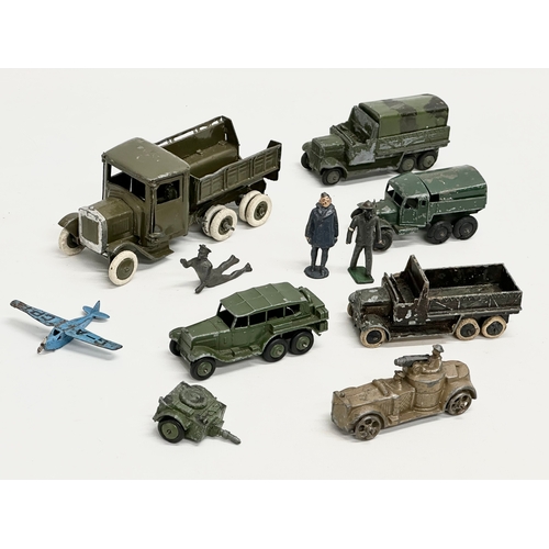 531 - A collection of vintage Britains and Dinky military vehicles and figures.