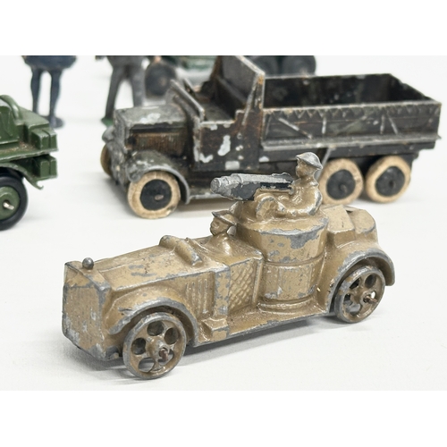 531 - A collection of vintage Britains and Dinky military vehicles and figures.