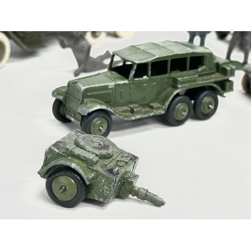 531 - A collection of vintage Britains and Dinky military vehicles and figures.