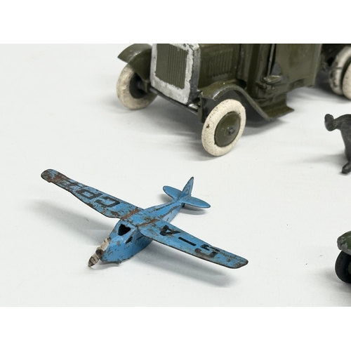 531 - A collection of vintage Britains and Dinky military vehicles and figures.