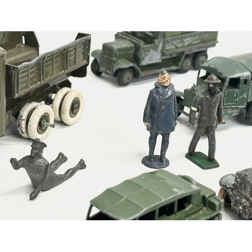 531 - A collection of vintage Britains and Dinky military vehicles and figures.