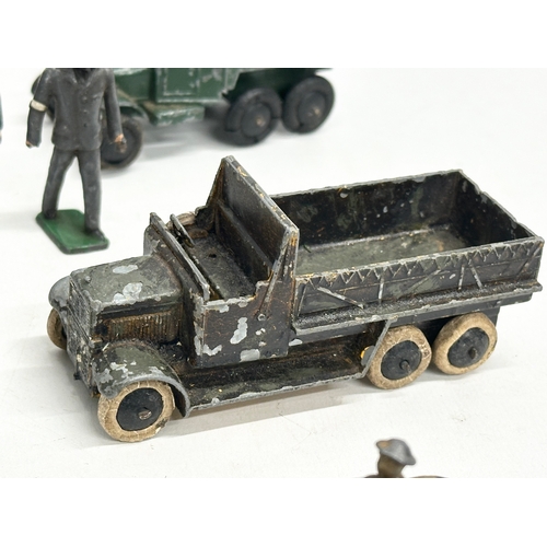 531 - A collection of vintage Britains and Dinky military vehicles and figures.